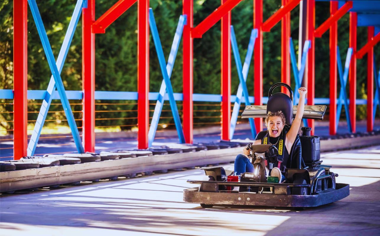 Racers speeding around a high-speed go-kart track in Pigeon Forge.
