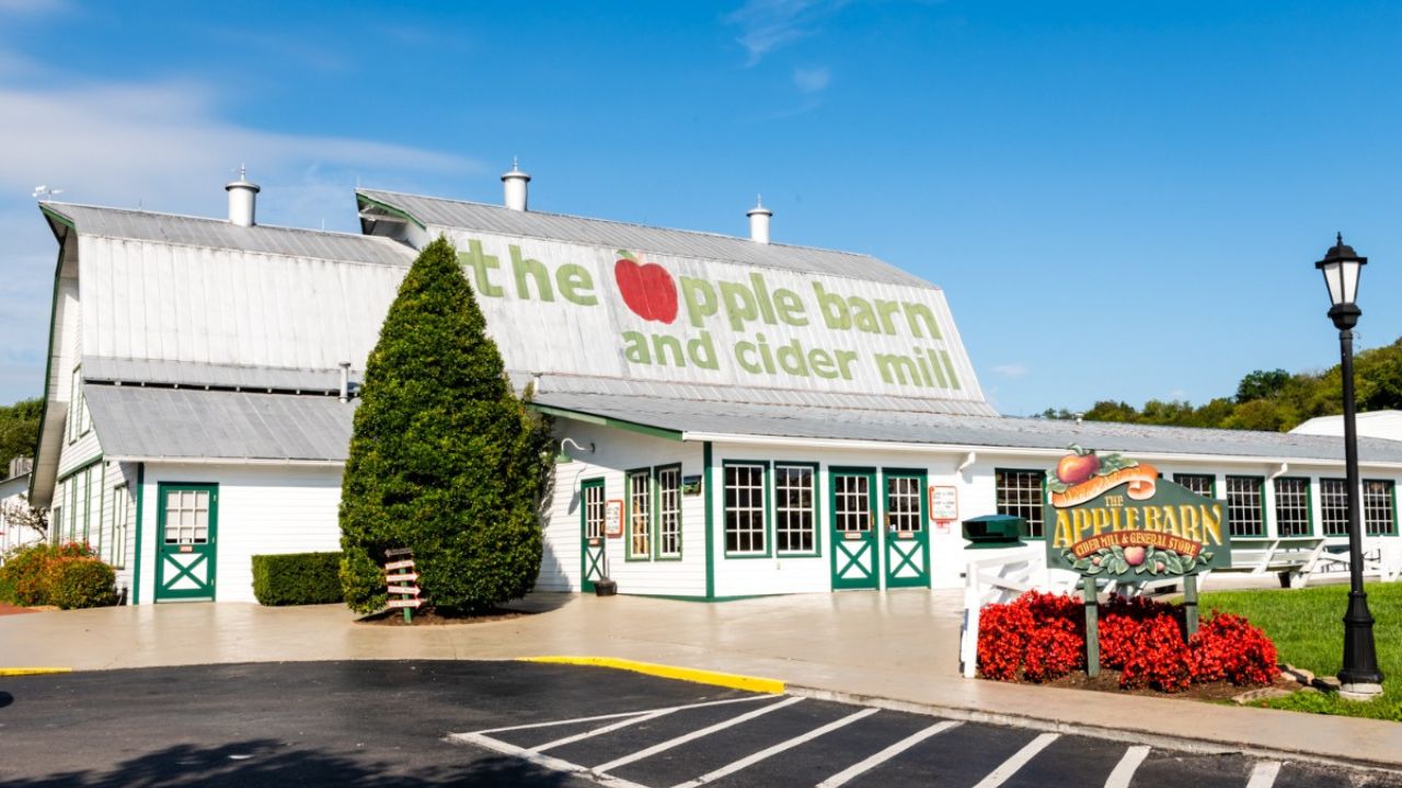 The Apple Barn & Cider Mill, featuring rows of fresh apples and homemade cider.