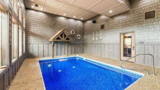 A serene indoor swimming pool at a Gatlinburg cabin, inviting and cool.