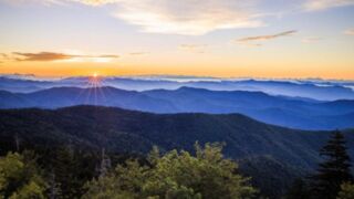 A sunrise or sunset vista capturing vibrant colors over the Smoky Mountains.