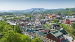 An aerial view of The Island in Pigeon Forge, showcasing its Ferris wheel and vibrant attractions.