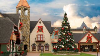 The exterior of The Incredible Christmas Place, adorned with festive lights and holiday decorations.